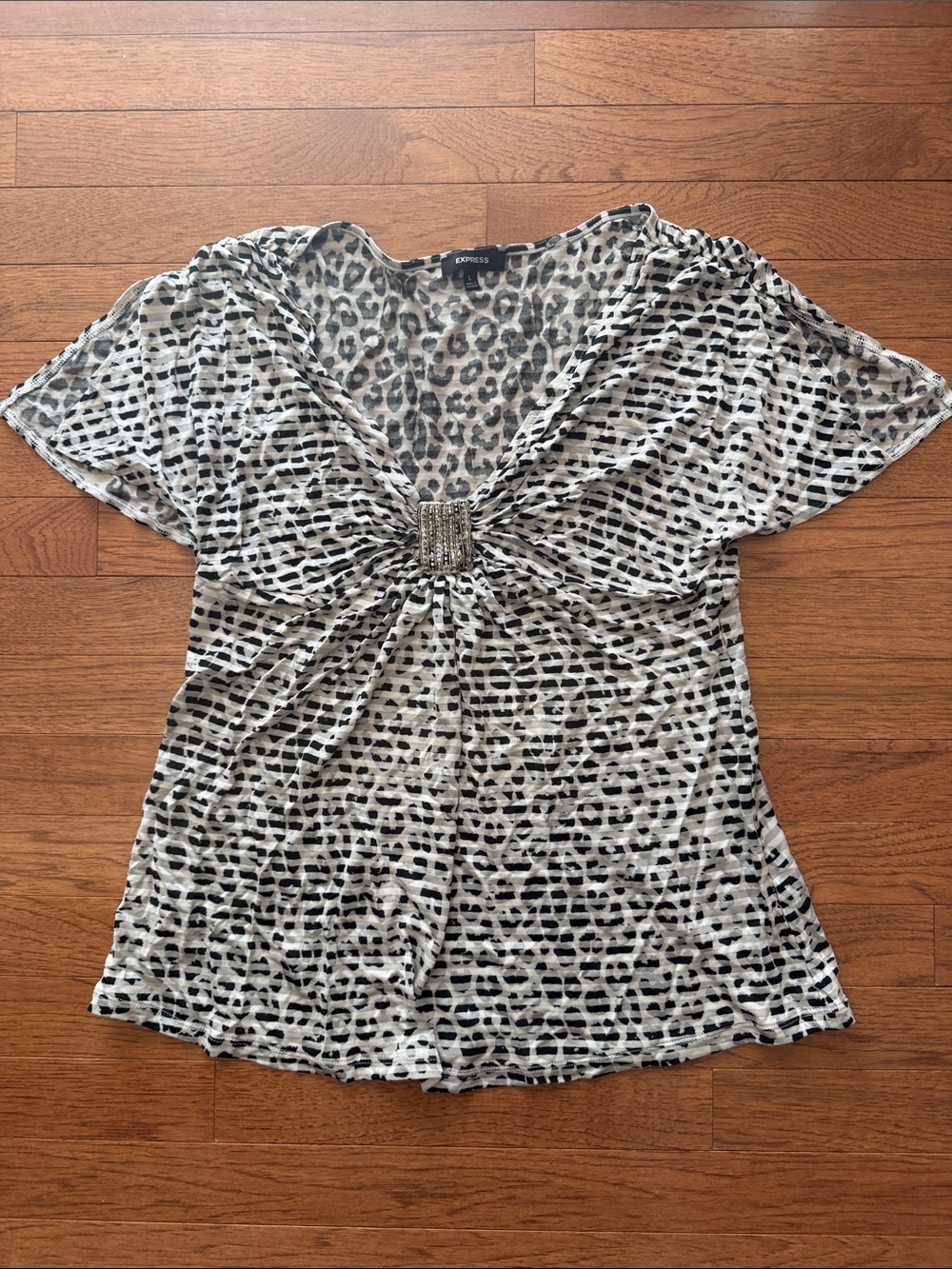 Express Women's Black and White Animal Print V-Neck Top with Embellished Twist
